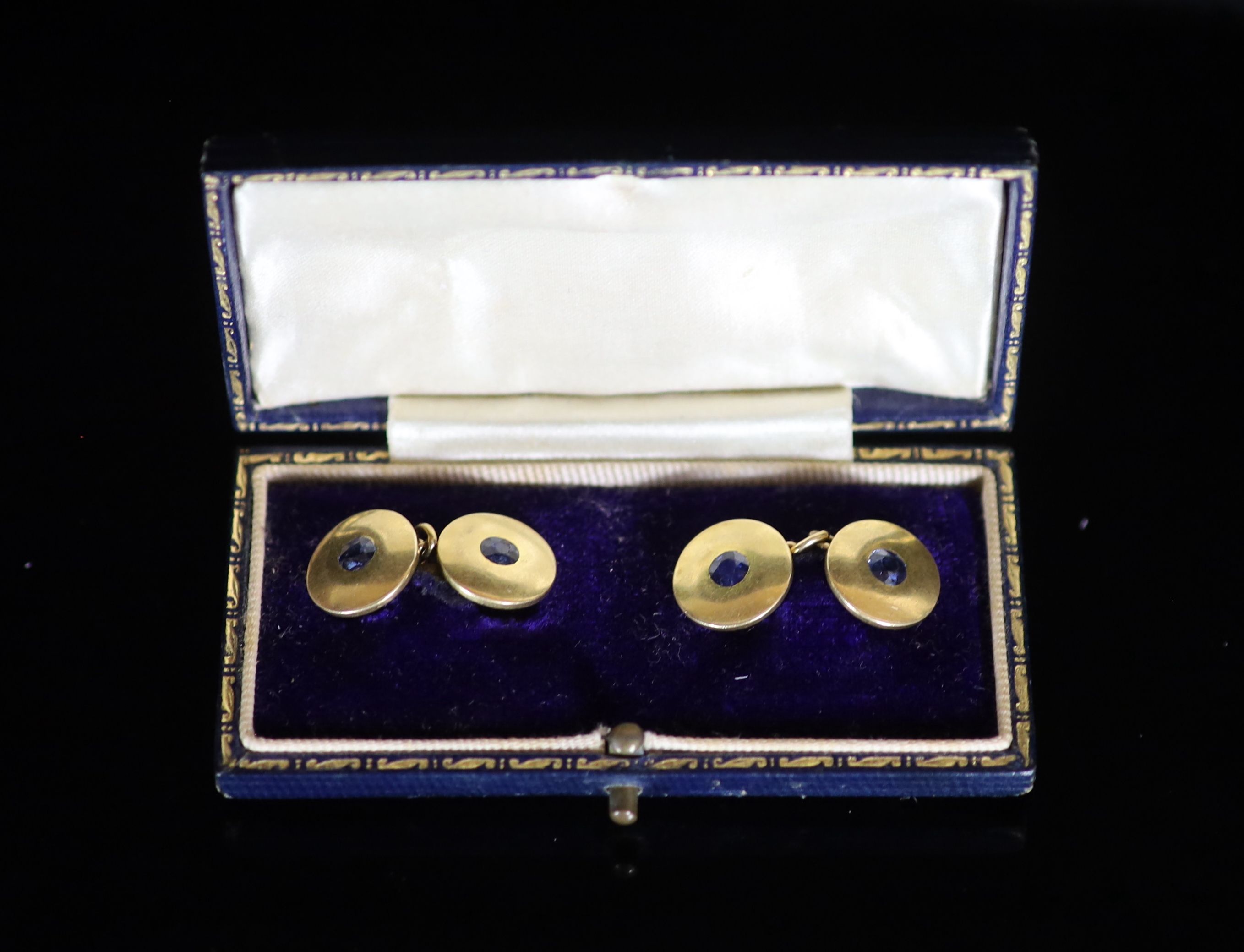 A pair of 18ct gold and sapphire set double disc cufflinks